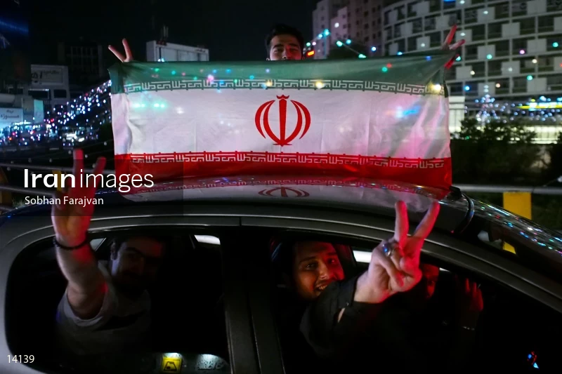 Iranian fans celebrate victory against Morocco